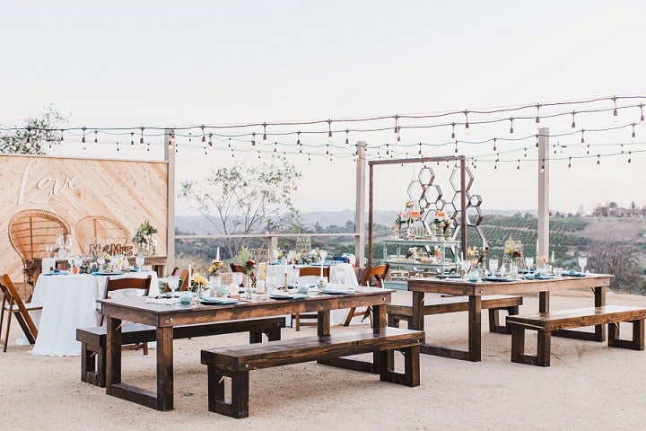 Outdoor reception with love letters and string lights