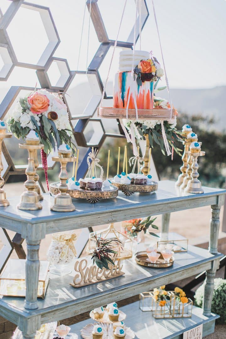 Colorful floral dessert table with geometric details